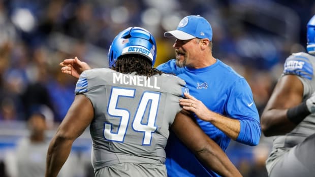 Detroit Lions defensive tackle Alim McNeill embraces coach Dan Campbell.